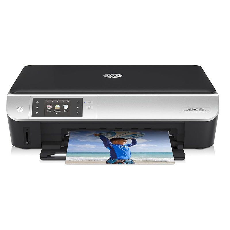 HP ENVY 5530 e-All-in-One printer printing a colorful photo, featuring a compact design with a touchscreen for easy navigation.