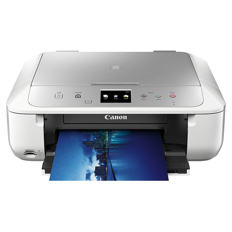 Canon PIXMA MG6853 inkjet printer printing a vibrant color photo with wireless capabilities.
