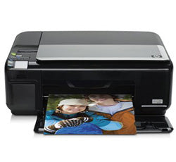 HP PhotoSmart C4599 multifunction printer with printed photo showing its high-quality color output.