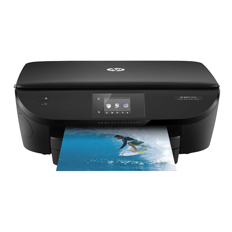 HP ENVY 5644 e-All-in-One printer with a surfing photo being printed, showcasing its wireless and multifunctional capabilities.